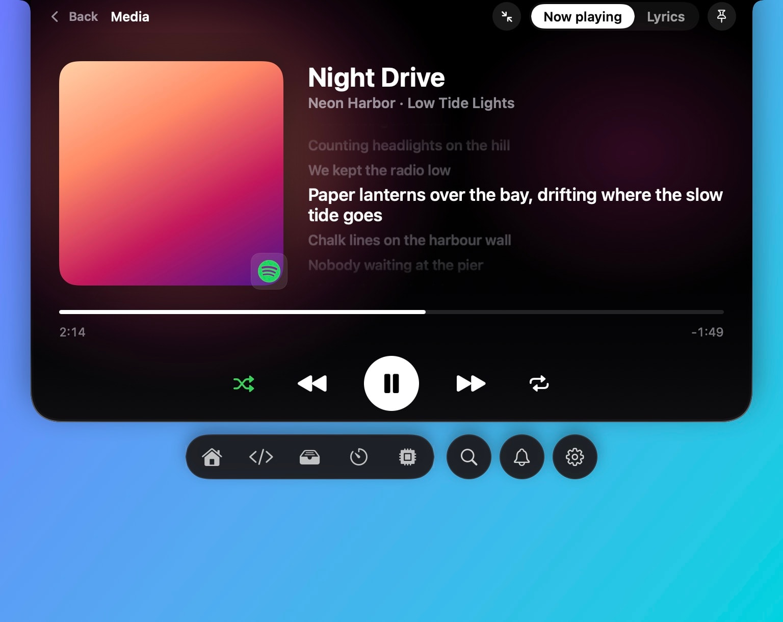 The media panel at full size: album art, the current lyric line highlighted, the lines around it dimmed, and the player controls.