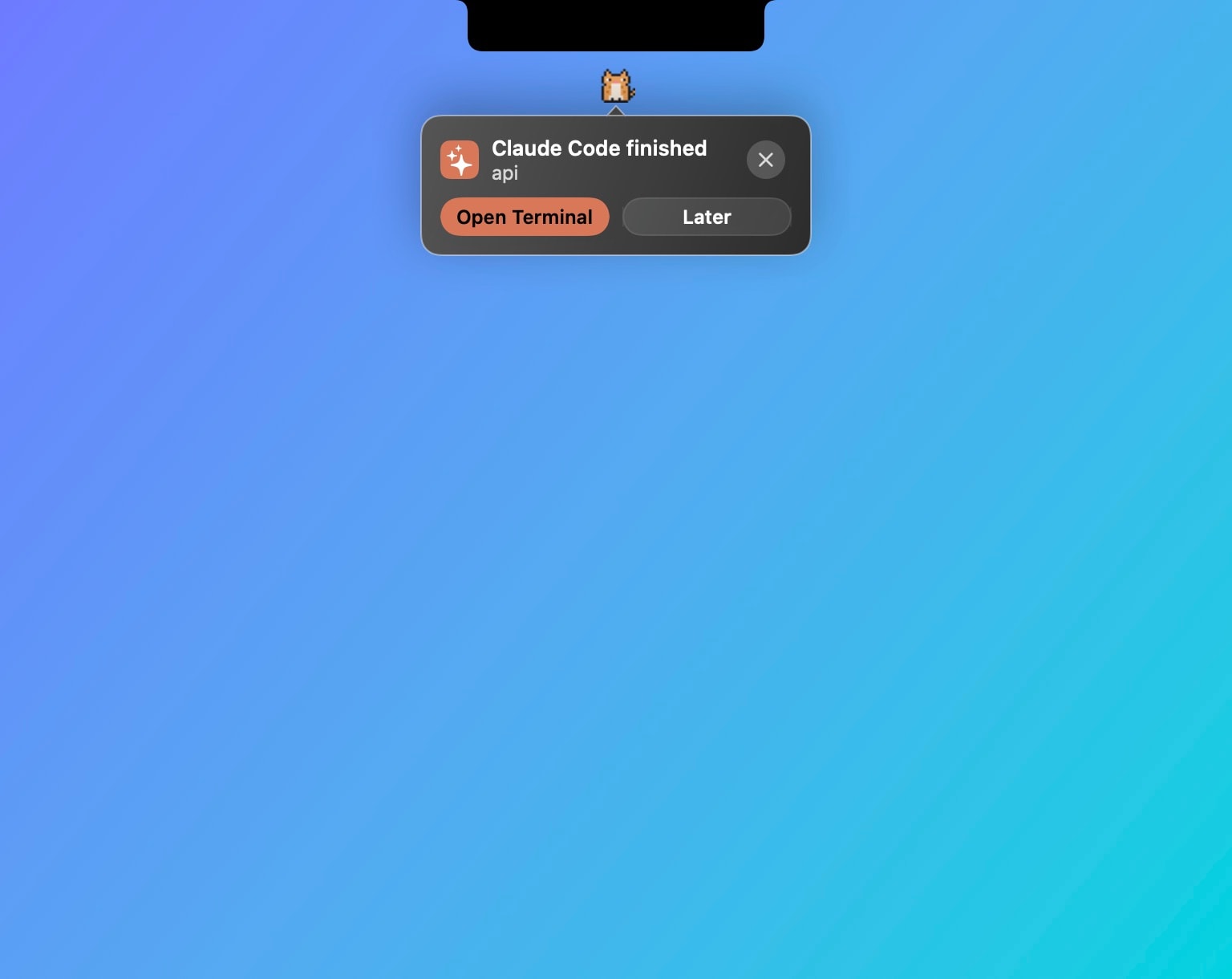 The pet beside the notch with a message: Claude Code finished, with Open Terminal and Later.
